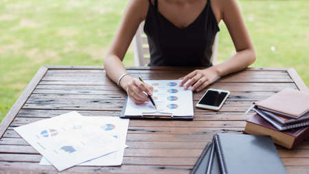 Business team working on laptop, while sitting at office. Business people.の写真素材