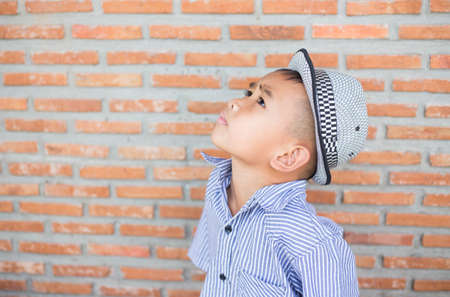 Boy deep in thoughtの写真素材
