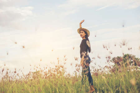 Silhouette of woman praying over beautiful sky backgroundの写真素材
