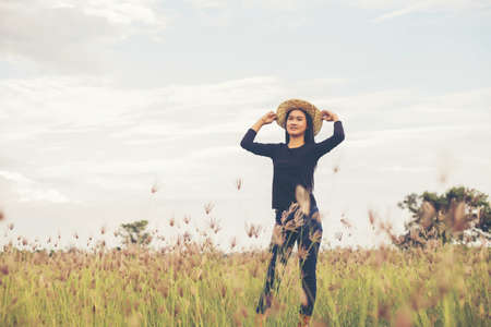 Silhouette of woman praying over beautiful sky background