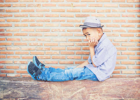 Boy deep in thoughtの写真素材