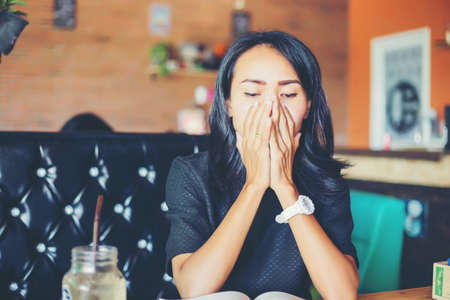 Woman sitting alone and depressedの写真素材