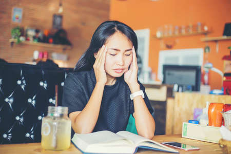 Woman sitting alone and depressedの写真素材