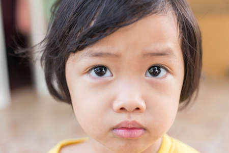 Funny little girl portraitの写真素材