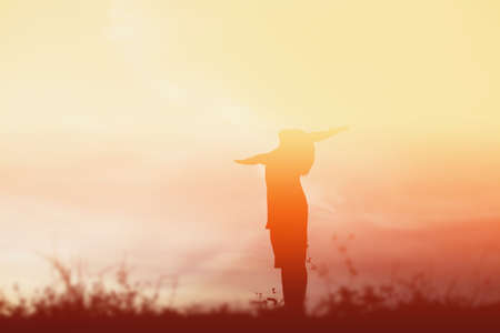 kid silhouette,Moments of the child's joy. On the Nature sunsetの写真素材