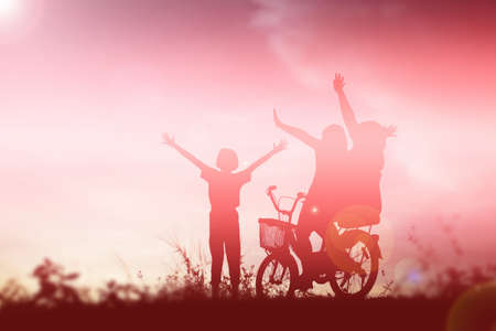 silhouette of a happy children and happy time sunsetの写真素材