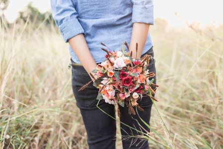 Freshly cut flowers in woman's handの写真素材