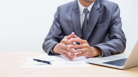 Business team working on laptop, while sitting at office. Business people. の写真素材