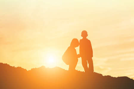 kid silhouette,Moments of the child's joy. On the Nature sunsetの写真素材