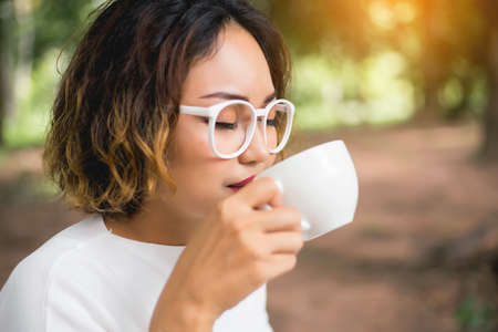 Woman enjoying fresh cooffee stock photo