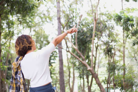 Young woman raise hands up for her success, Concept of Success in life.