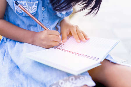 Happy cute child girl on the blur green background.の写真素材