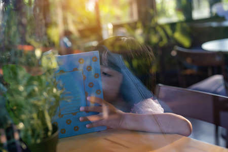 Child education. Girl reading book. の写真素材