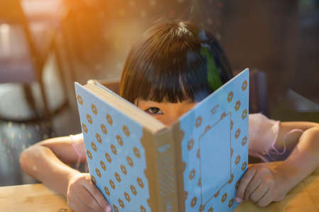 Child education. Girl reading book. の写真素材