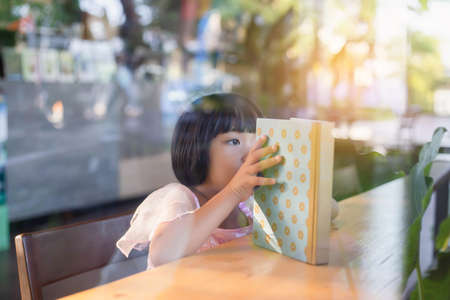 Child education. Girl reading book. の写真素材