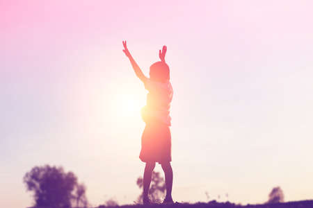 kid silhouette,Moments of the child's joy. On the Nature sunsetの写真素材
