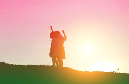 kid silhouette,Moments of the child's joy. On the Nature sunsetの写真素材