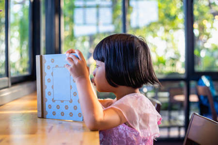Child education. Girl reading book. の写真素材