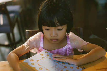 Child education. Girl reading book.の写真素材