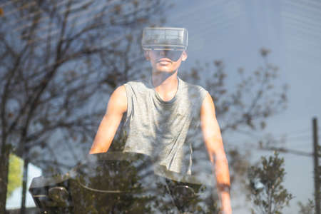 People exercising on a treadmill use it with a VR goggles headset.