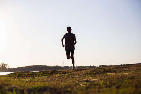 The man with runner on the street be running for exercise.の写真素材