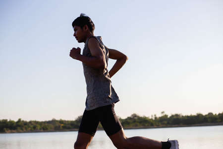 The man with runner on the street be running for exercise.の写真素材