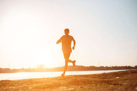 The man with runner on the street be running for exercise.の写真素材