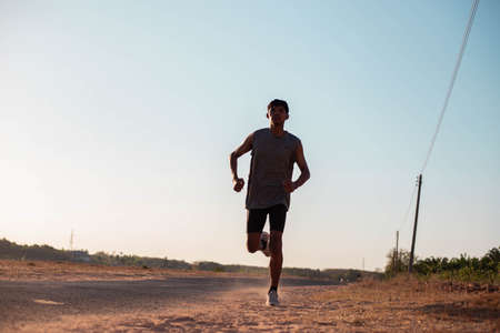The man with runner on the street be running for exercise.の写真素材