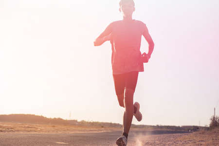 The man with runner on the street be running for exercise.の写真素材