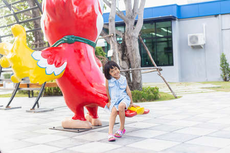Happy cute child girl on the blur green background.の写真素材