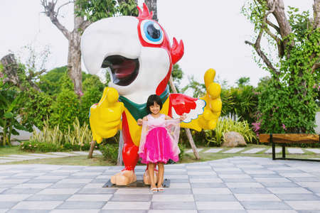 Happy cute child girl on the blur green background.の写真素材