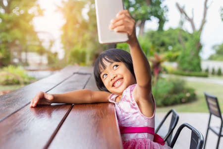 Asian Child Happy Use Talephone In communicateの写真素材