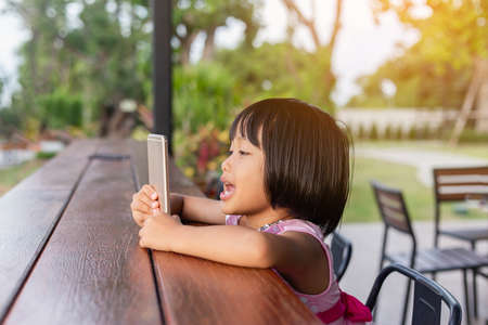 Asian Child Happy Use Talephone In communicateの写真素材