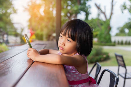 Asian Child Happy Use Talephone In communicateの写真素材