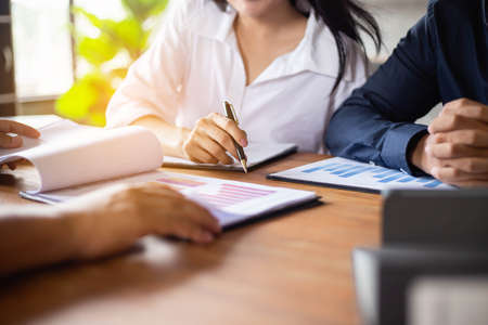 Teamwork with two business people in office with business analysis stock photoの写真素材
