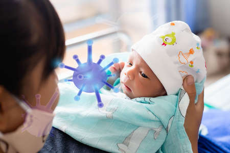 newborn baby looking at the cameraの写真素材