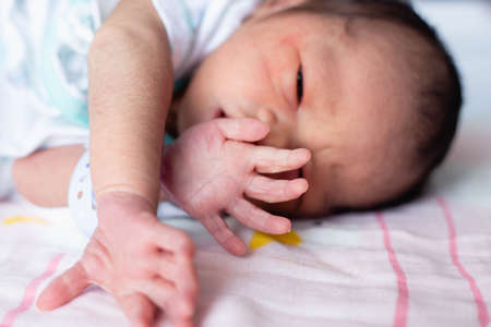 Small delicate little hand of newborn - close portrait