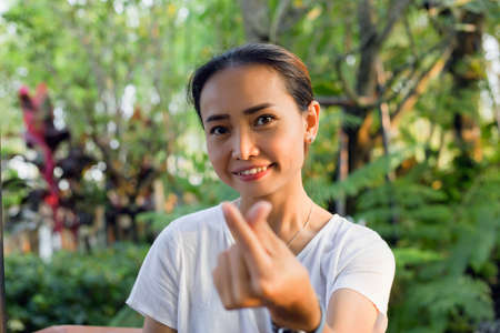 Hand of Young Woman Enjoying Nature with sunrise.の写真素材