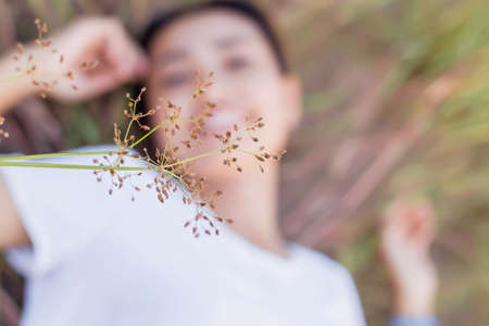 Hand of Young Woman Enjoying Nature with sunrise.の写真素材
