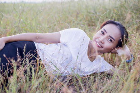 Hand of Young Woman Enjoying Nature with sunrise.の写真素材