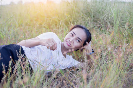 Hand of Young Woman Enjoying Nature with sunrise.の写真素材