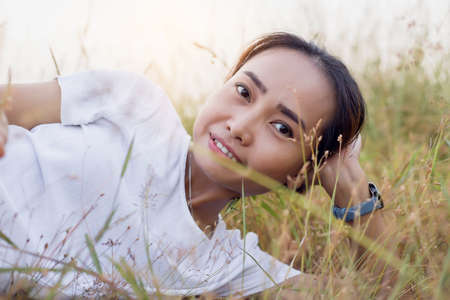 Hand of Young Woman Enjoying Nature with sunrise.の写真素材