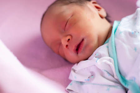 Cute asian baby newborn close upの写真素材