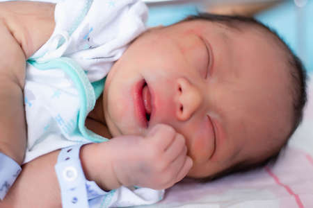 Cute asian baby newborn close upの写真素材