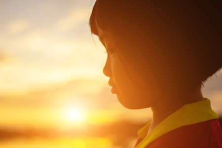 kid silhouette,Moments of the child's joy. On the Nature sunsetの写真素材