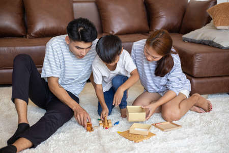 happy family playing at home,Mom and baby are happiness coexistence,happy family concept and Creating activities to strengthen skills for children.の写真素材