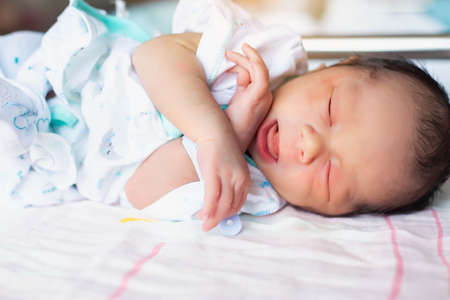Cute asian baby newborn close upの写真素材