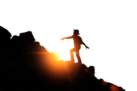 silhouette of a young man standing aloneの写真素材