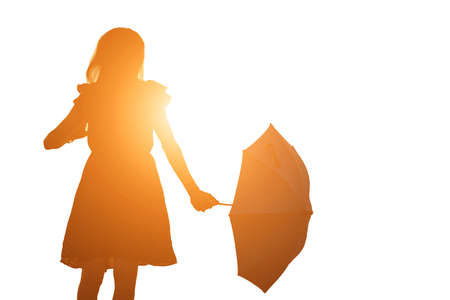 Silhouette of woman praying over beautiful sky backgroundの写真素材