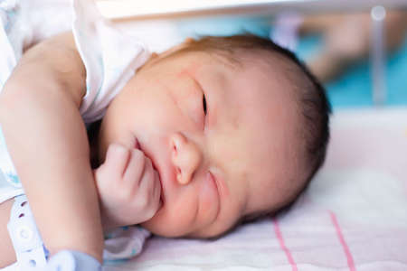 Cute asian baby newborn close upの写真素材